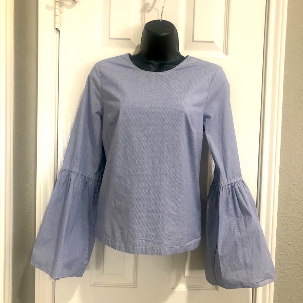 a•n•d e a w y bell shaped long sleeved top.